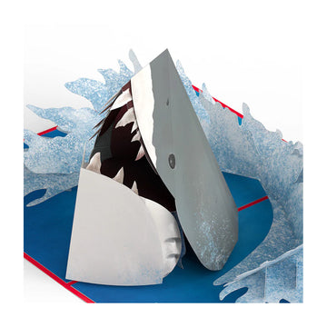 Shark-shaped pool float with a blue base and red trim on a white JAWS 50th Anniversary Greeting Card